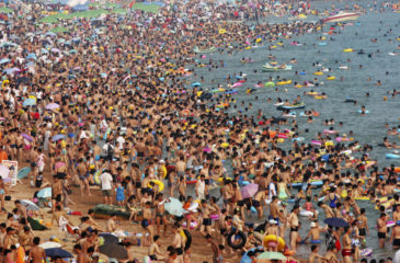 People play on a beach in Qingdao